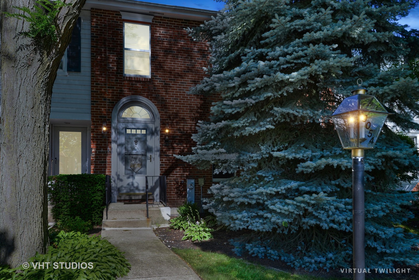 9054 Forestview Road Evanston, IL 60203 - Photo 2 of 24 a front view of a house with yard