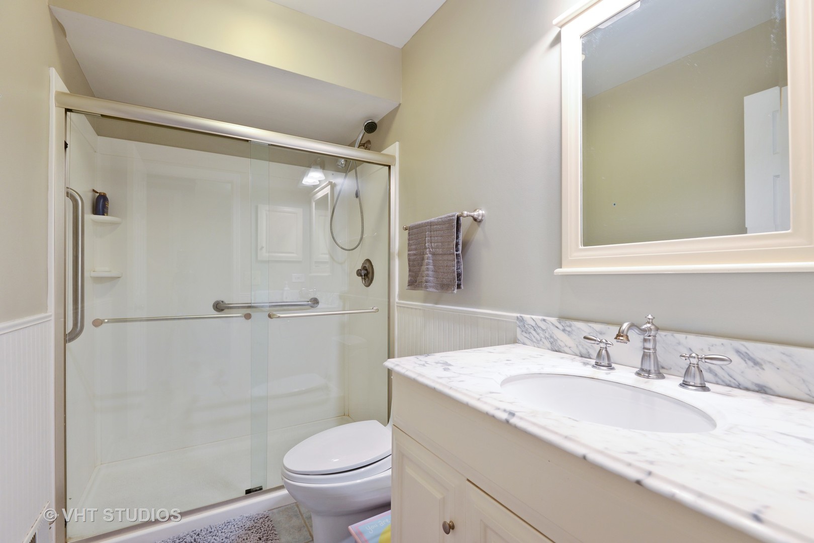 9054 Forestview Road Evanston, IL 60203 - Photo 16 of 24 a bathroom with a granite countertop sink toilet and shower