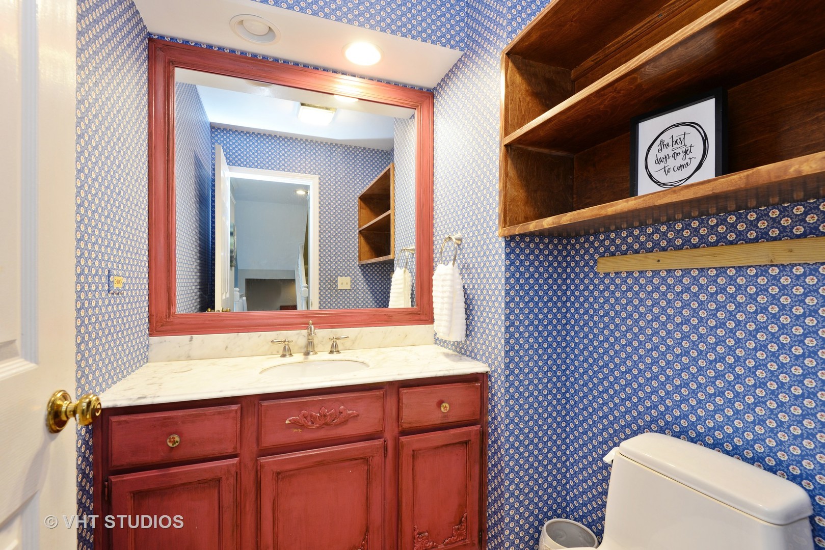 9054 Forestview Road Evanston, IL 60203 - Photo 17 of 24 a bathroom with a sink a toilet and mirror