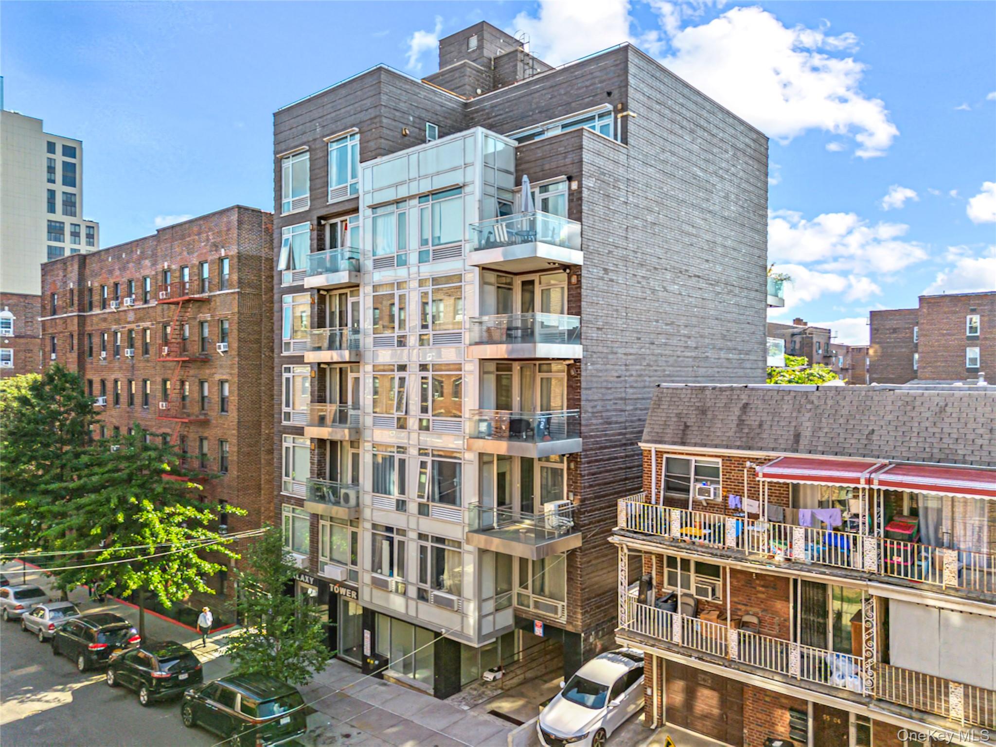 95-08 65th Road, Unit 3C Queens, NY 11374 - Photo 1 of 19 View of apartment building / complex featuring a city view
