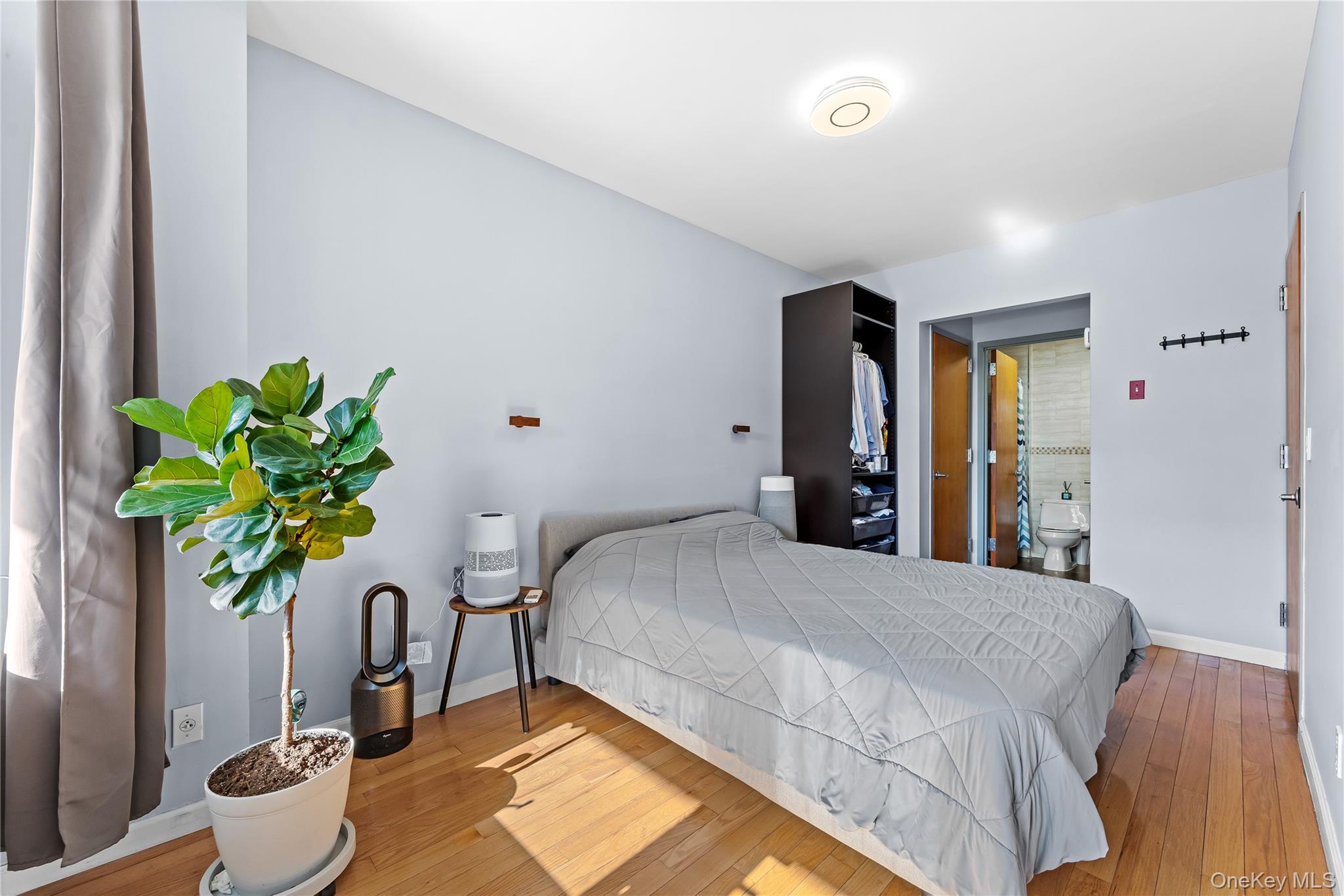 95-08 65th Road, Unit 3C Queens, NY 11374 - Photo 9 of 19 Bedroom with hardwood / wood-style flooring