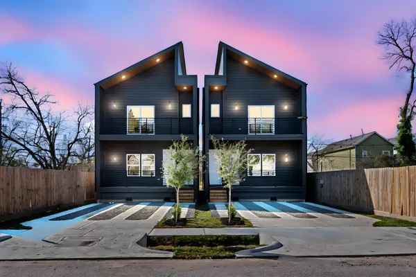 a front view of a house with garage