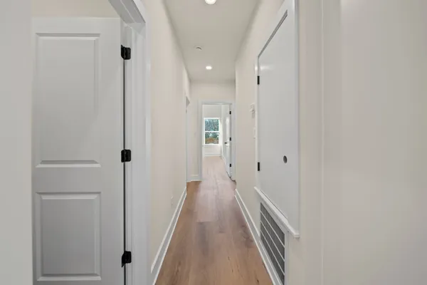an empty room with a window and a ceiling fan