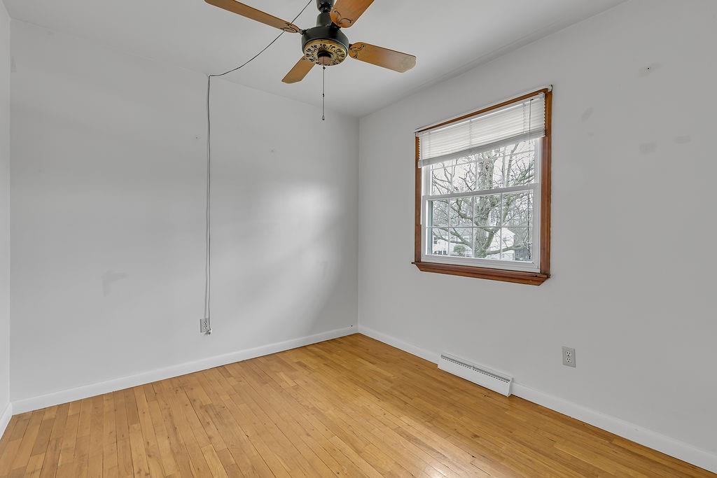 161 Maple Drive Beaver, PA 15009 - Photo 17 of 29 a view of an empty room with a window and wooden floor