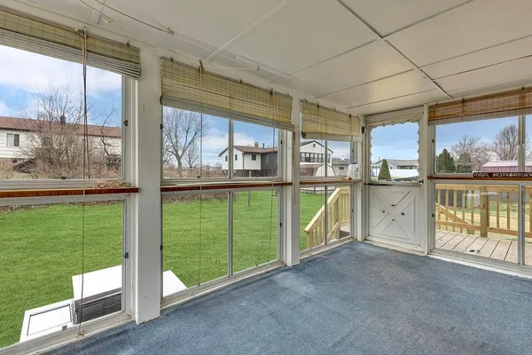 a view of a room with a large window