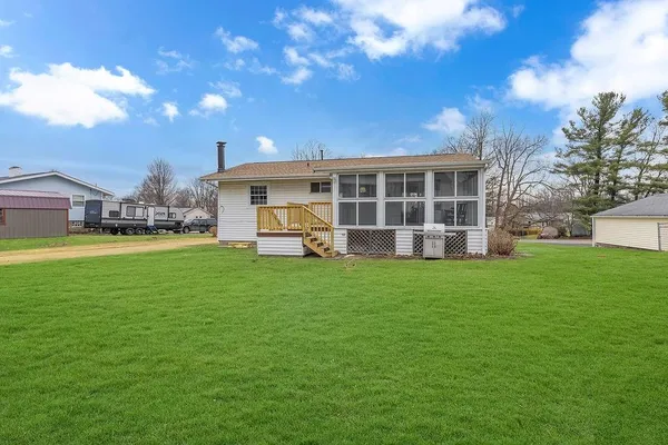 a view of a house with a yard