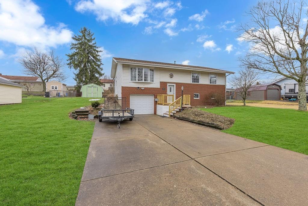 161 Maple Drive Beaver, PA 15009 - Photo 3 of 29 a front view of house with a garden