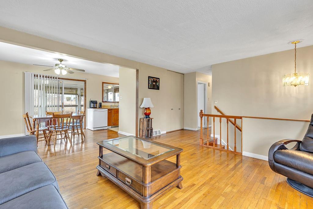 161 Maple Drive Beaver, PA 15009 - Photo 6 of 29 a living room with furniture a dining table and chairs