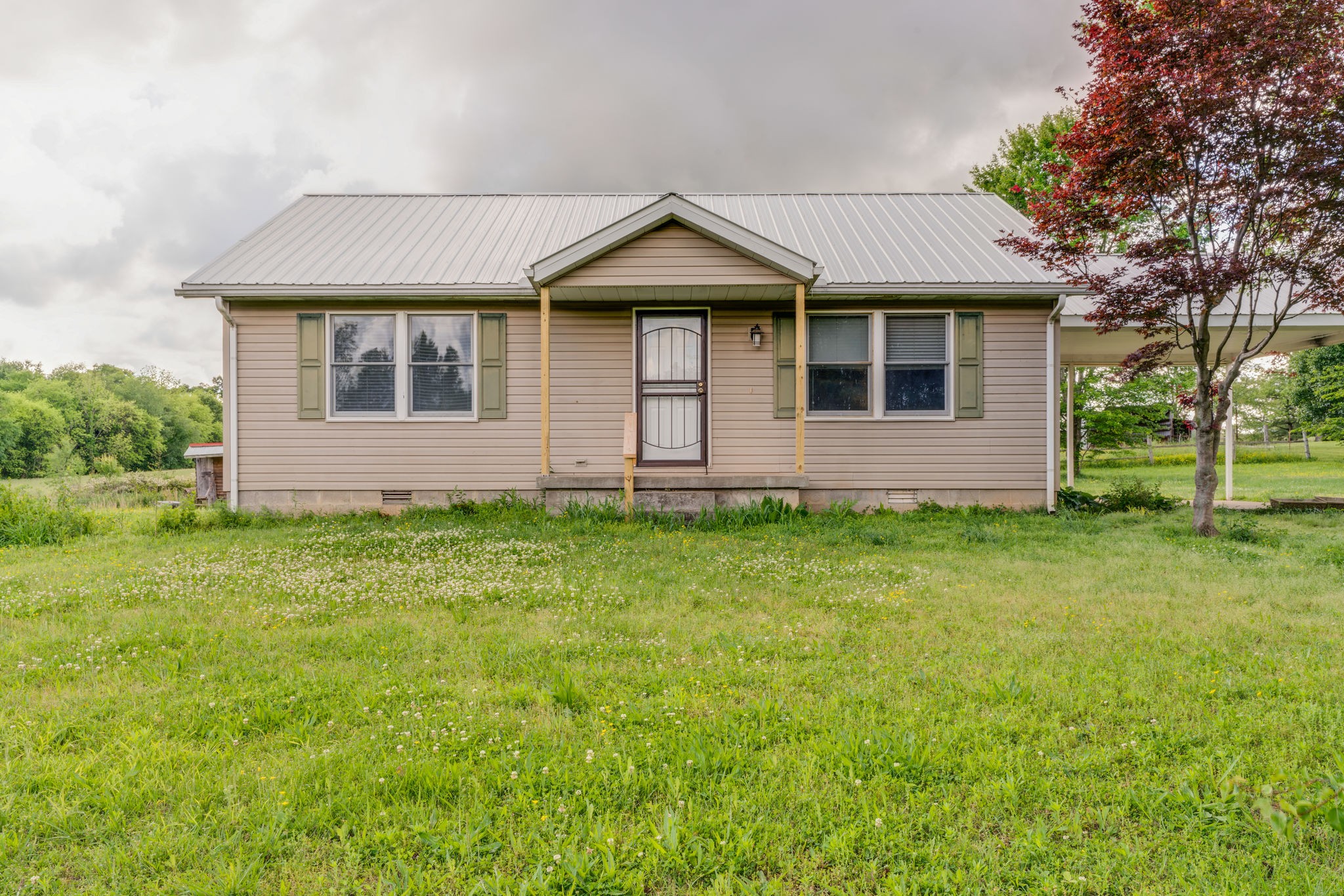 4614 Woodrow Wilson Road Springfield, TN 37172 - Photo 1 of 29 a front view of a house with a garden