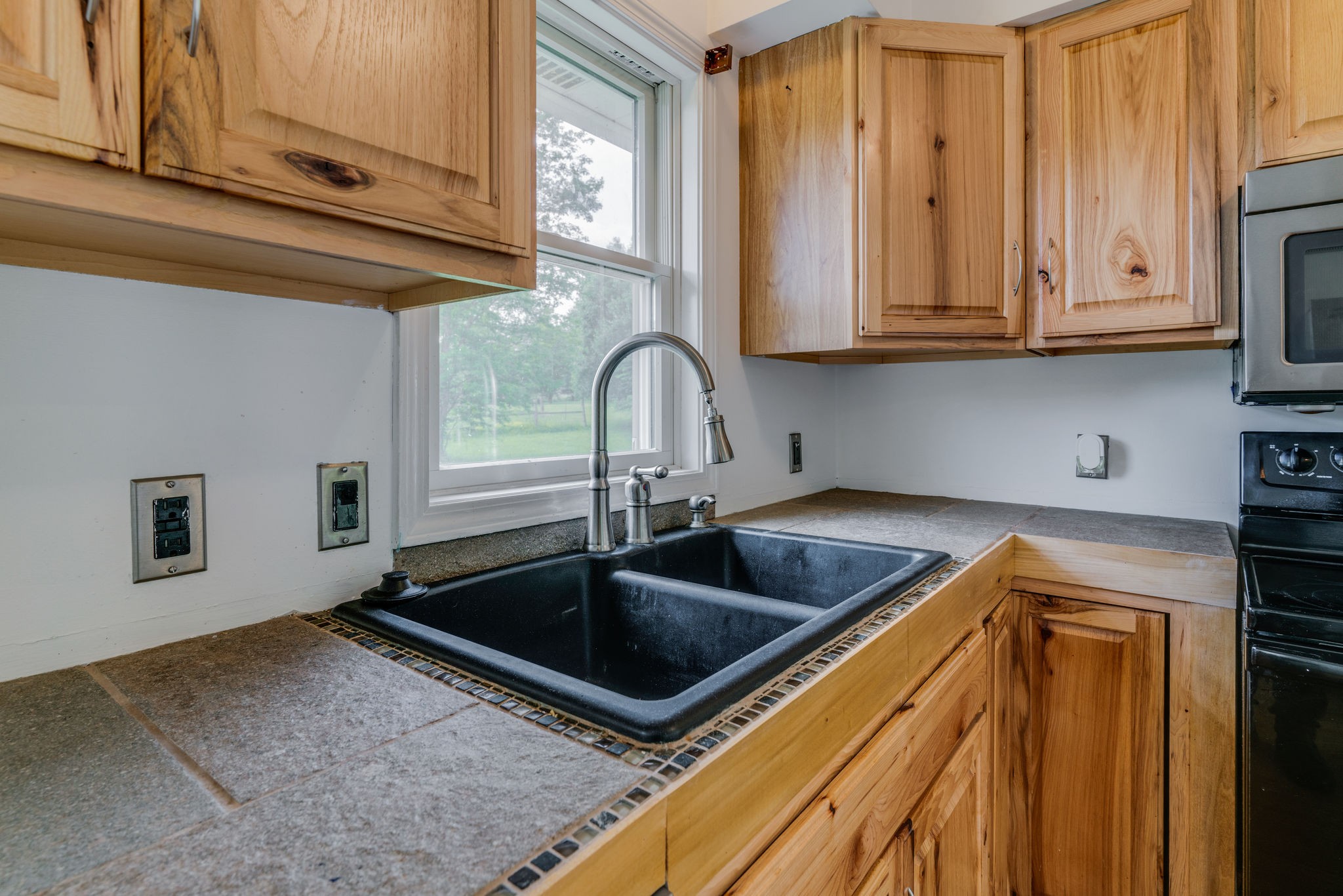 4614 Woodrow Wilson Road Springfield, TN 37172 - Photo 12 of 29 a kitchen with granite countertop a sink and cabinets