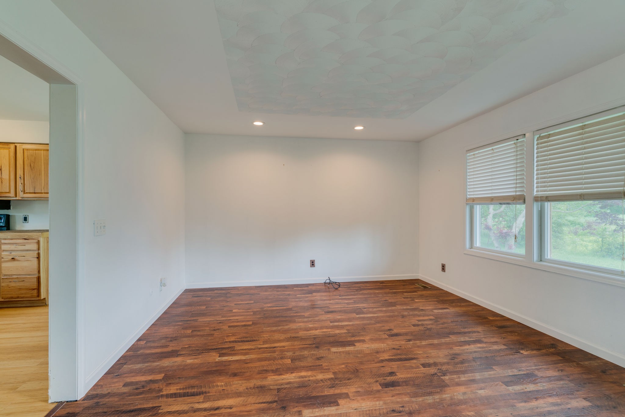 4614 Woodrow Wilson Road Springfield, TN 37172 - Photo 13 of 29 an empty room with wooden floor and windows