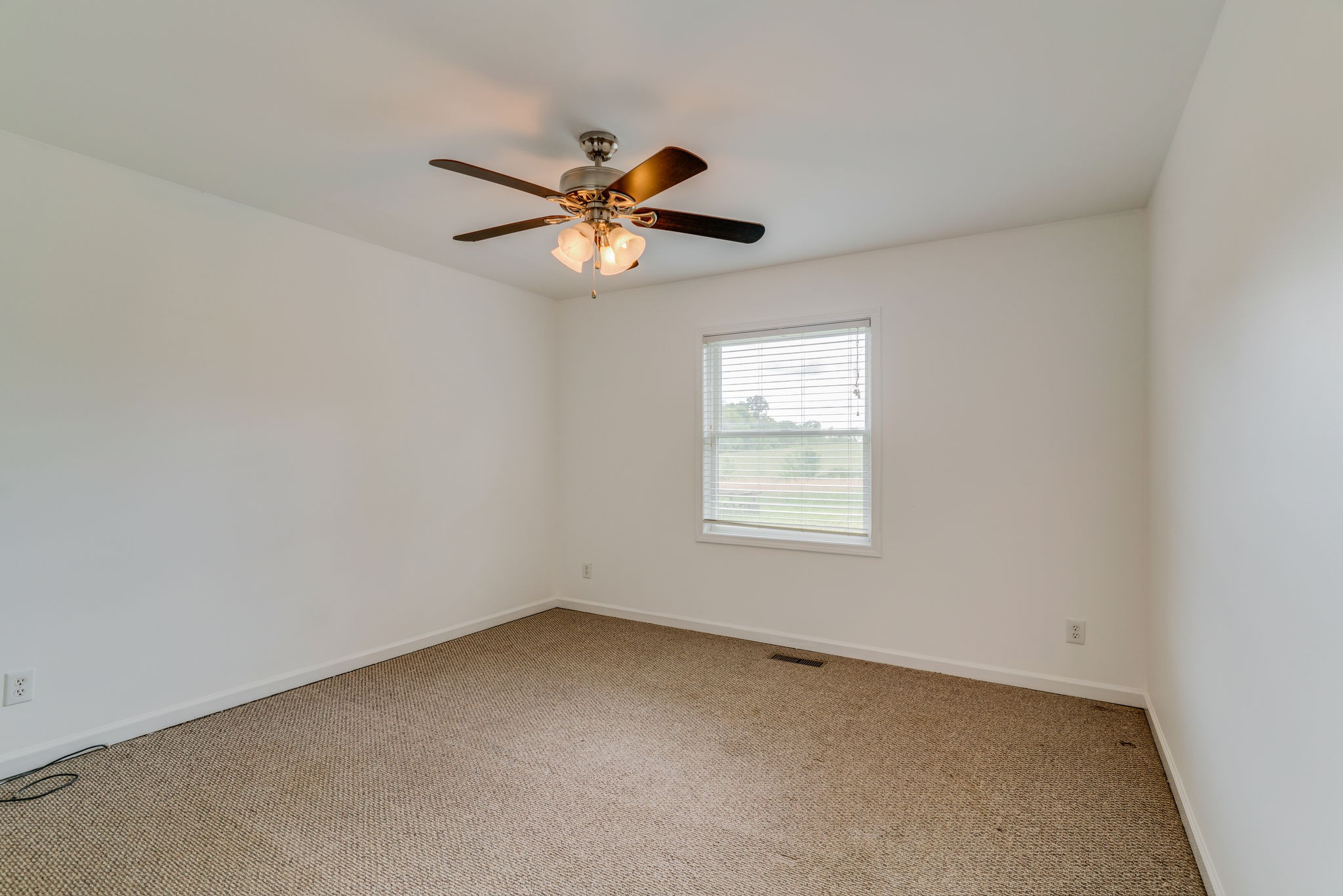 4614 Woodrow Wilson Road Springfield, TN 37172 - Photo 21 of 29 an empty room with a window and a fan