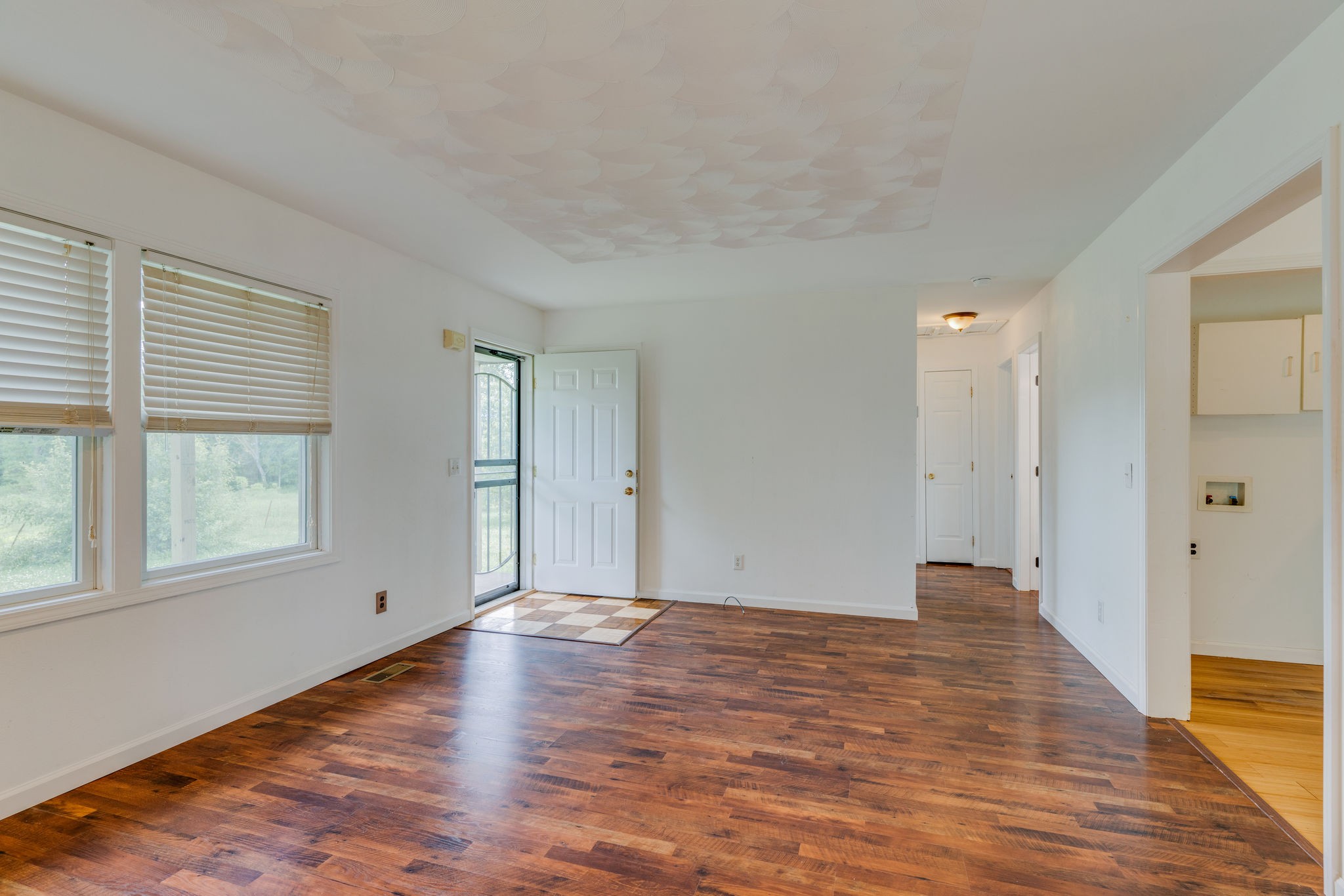 4614 Woodrow Wilson Road Springfield, TN 37172 - Photo 5 of 29 wooden floor in an empty room with a window