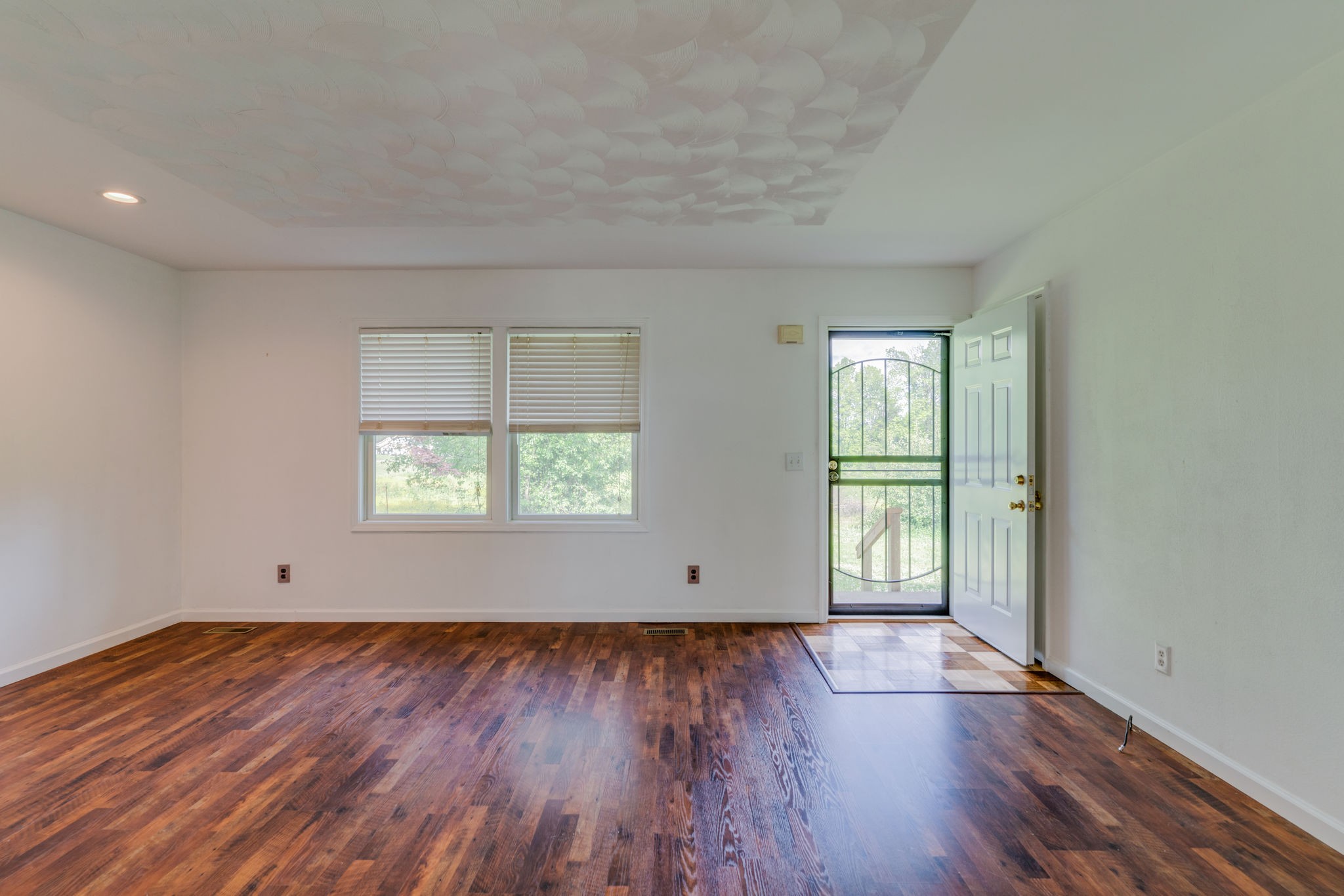 4614 Woodrow Wilson Road Springfield, TN 37172 - Photo 6 of 29 an empty room with wooden floor and windows