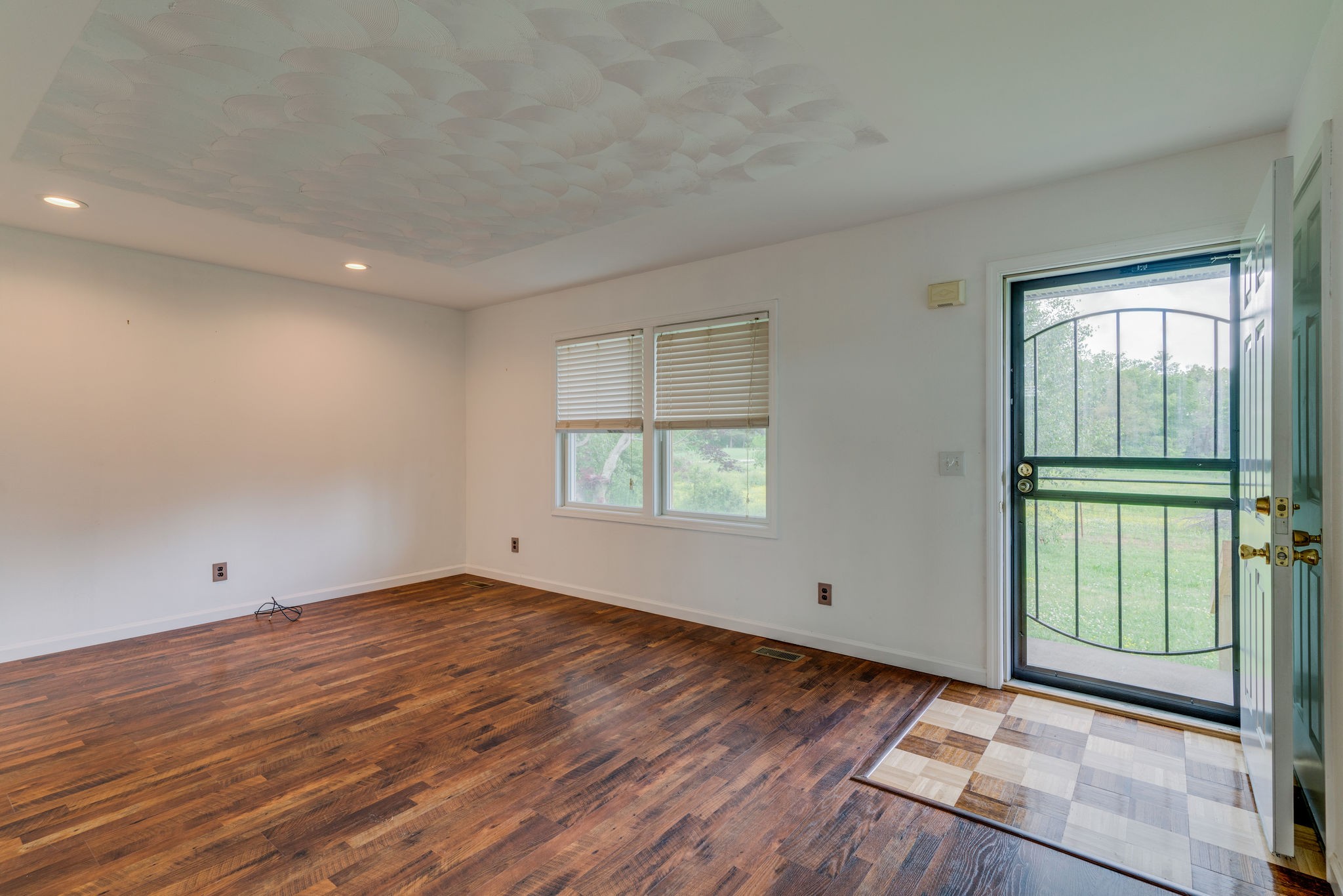 4614 Woodrow Wilson Road Springfield, TN 37172 - Photo 7 of 29 a view of an empty room with wooden floor and a window