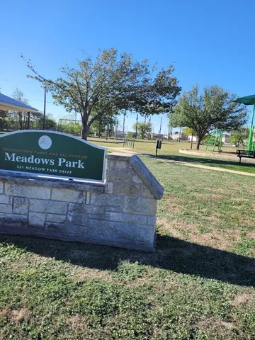 a view of a street with wooden house