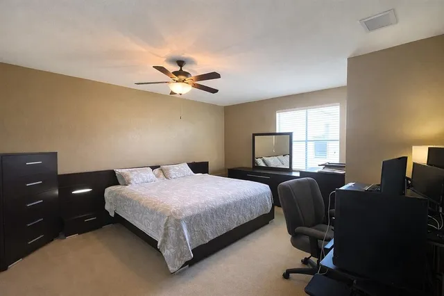 a bedroom with a bed and window