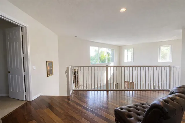 a view of a livingroom with furniture and wooden floor
