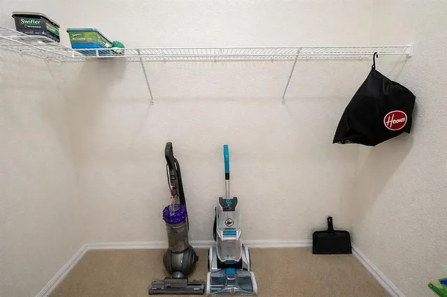 a view of storage and utility room with empty racks