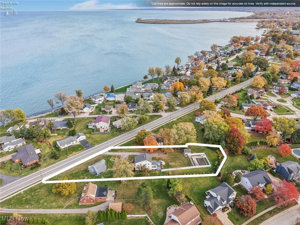 1208 Cleveland Road West Huron, OH 44839 - Photo 29 of 30 Aerial perspective of suburban area with property parcel outlined and a nearby body of water