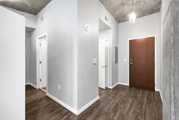 a view of a hallway with a white walls
