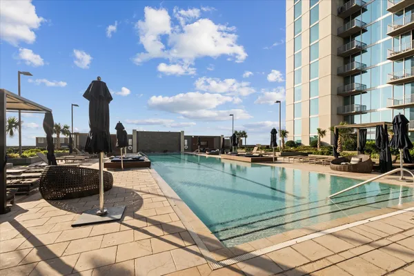 a view of a patio with couches and potted plants
