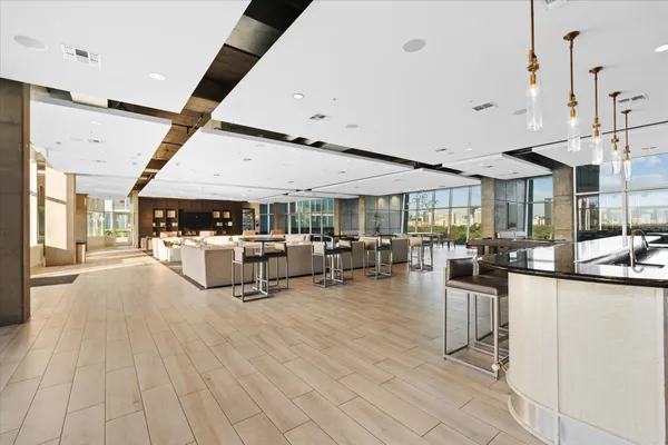 a backyard of a house with barbeque oven table and chairs