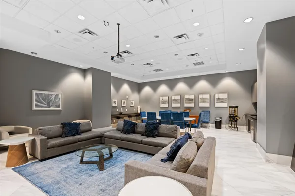 a view of a livingroom with furniture and a flat screen tv