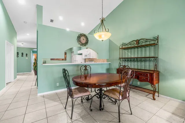 a view of a dining room and a table and chairs in a room