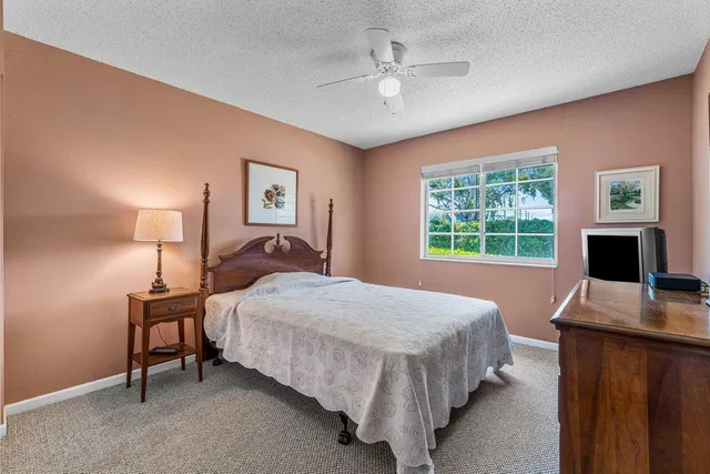 a bedroom with a bed and a desk