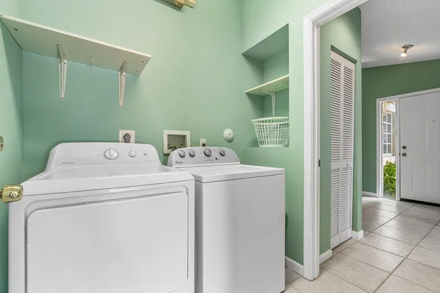 a utility room with dryer and washer