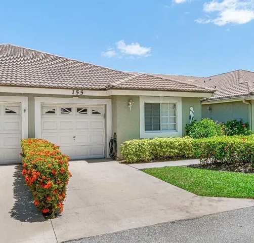 a front view of a house with a garage