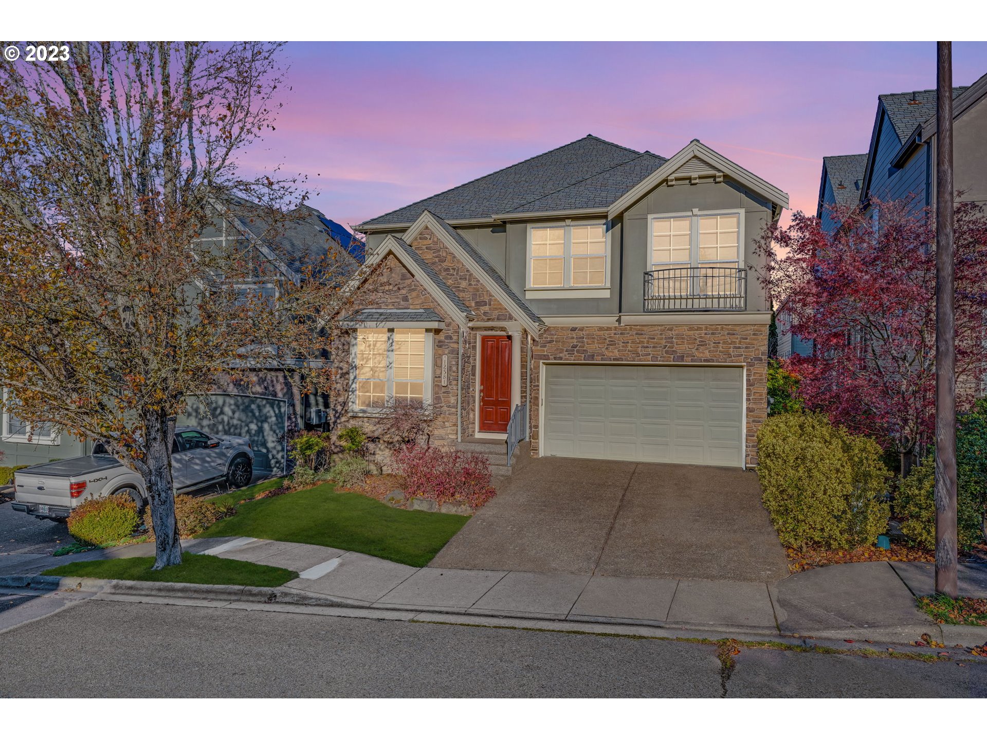 a front view of a house with garden
