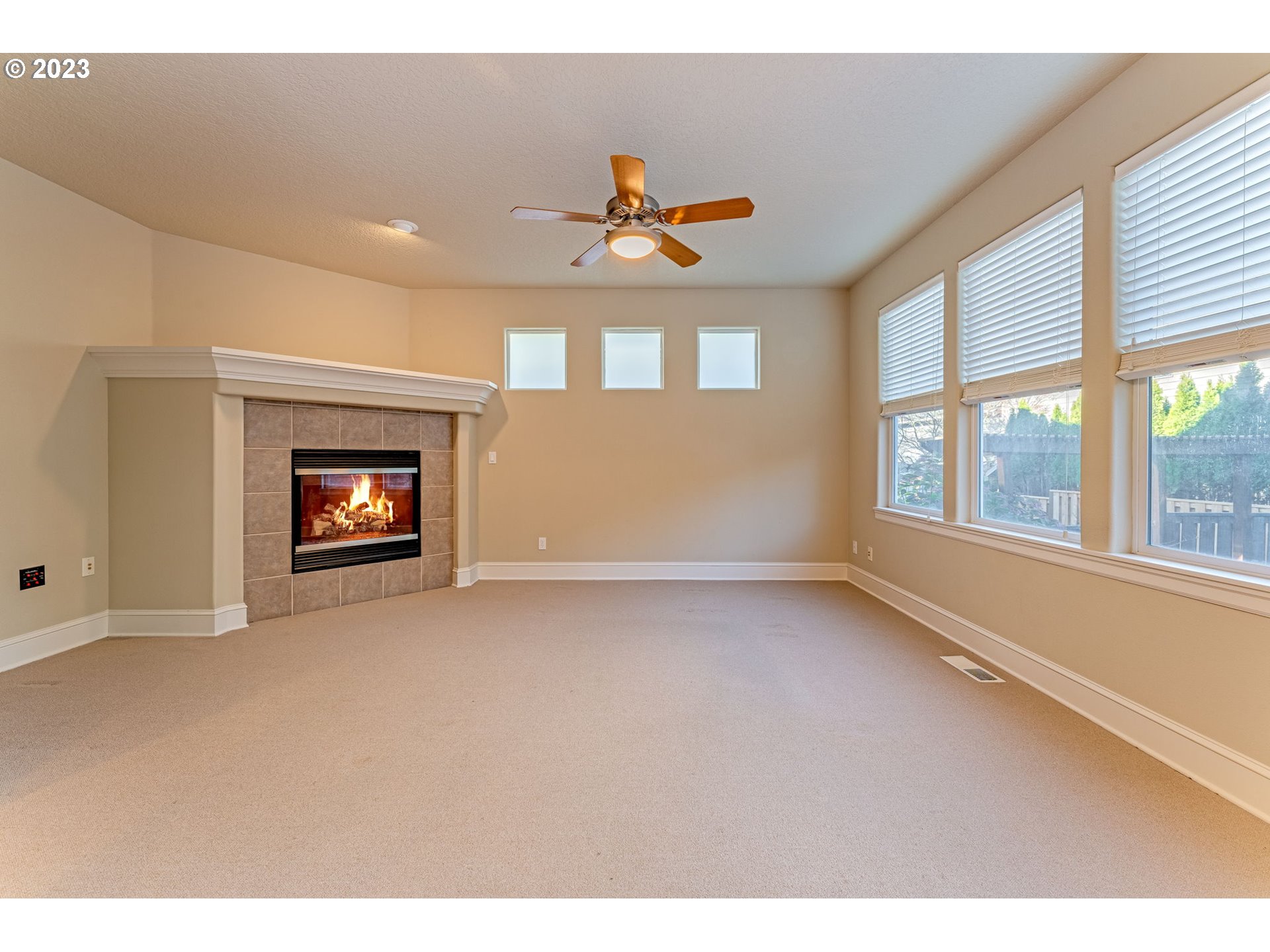 12581 Northwest Forest Spring Lane Portland, OR 97229 - Photo 13 of 48 a view of an empty room with a window