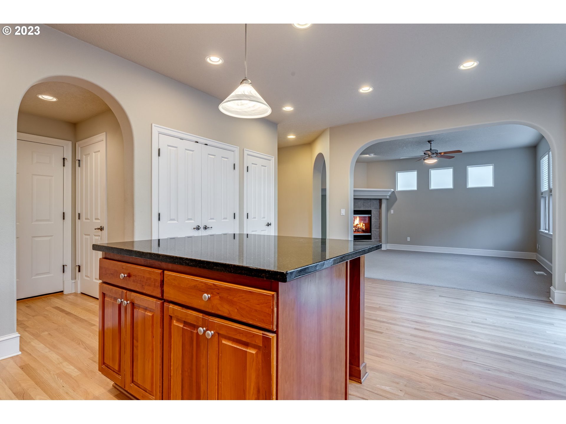 12581 Northwest Forest Spring Lane Portland, OR 97229 - Photo 22 of 48 a view of a hallway with wooden floor and cabinet