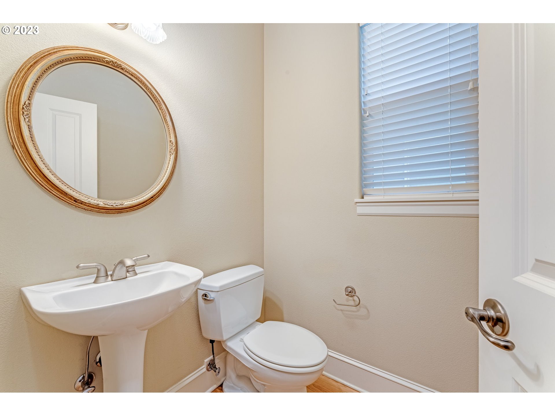 12581 Northwest Forest Spring Lane Portland, OR 97229 - Photo 23 of 48 a bathroom with a toilet a sink and a mirror