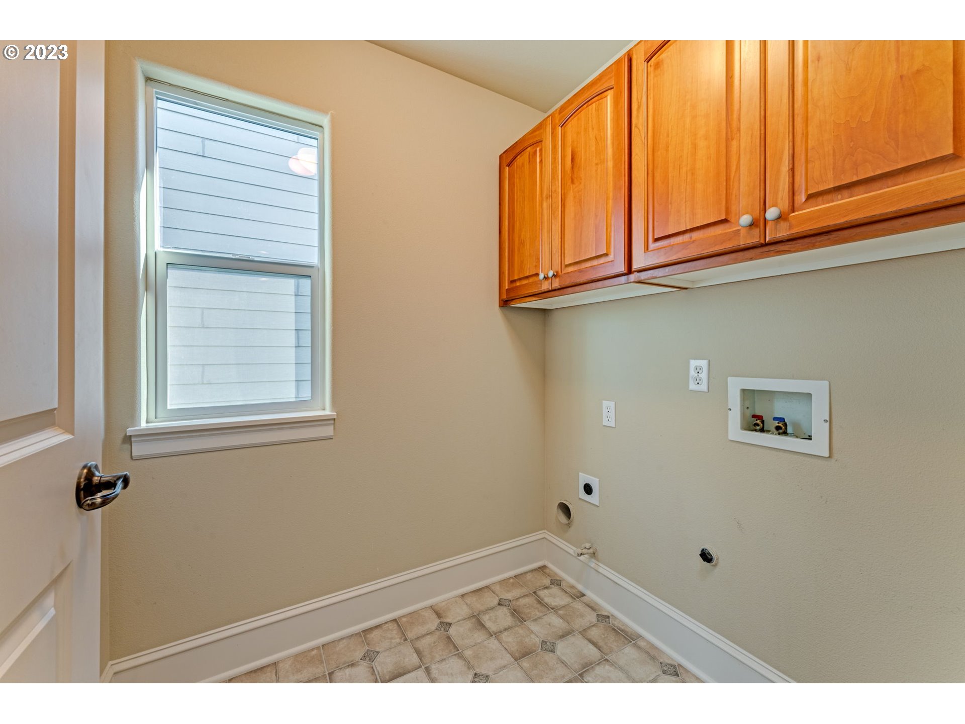12581 Northwest Forest Spring Lane Portland, OR 97229 - Photo 26 of 48 a view of a kitchen with wooden floor