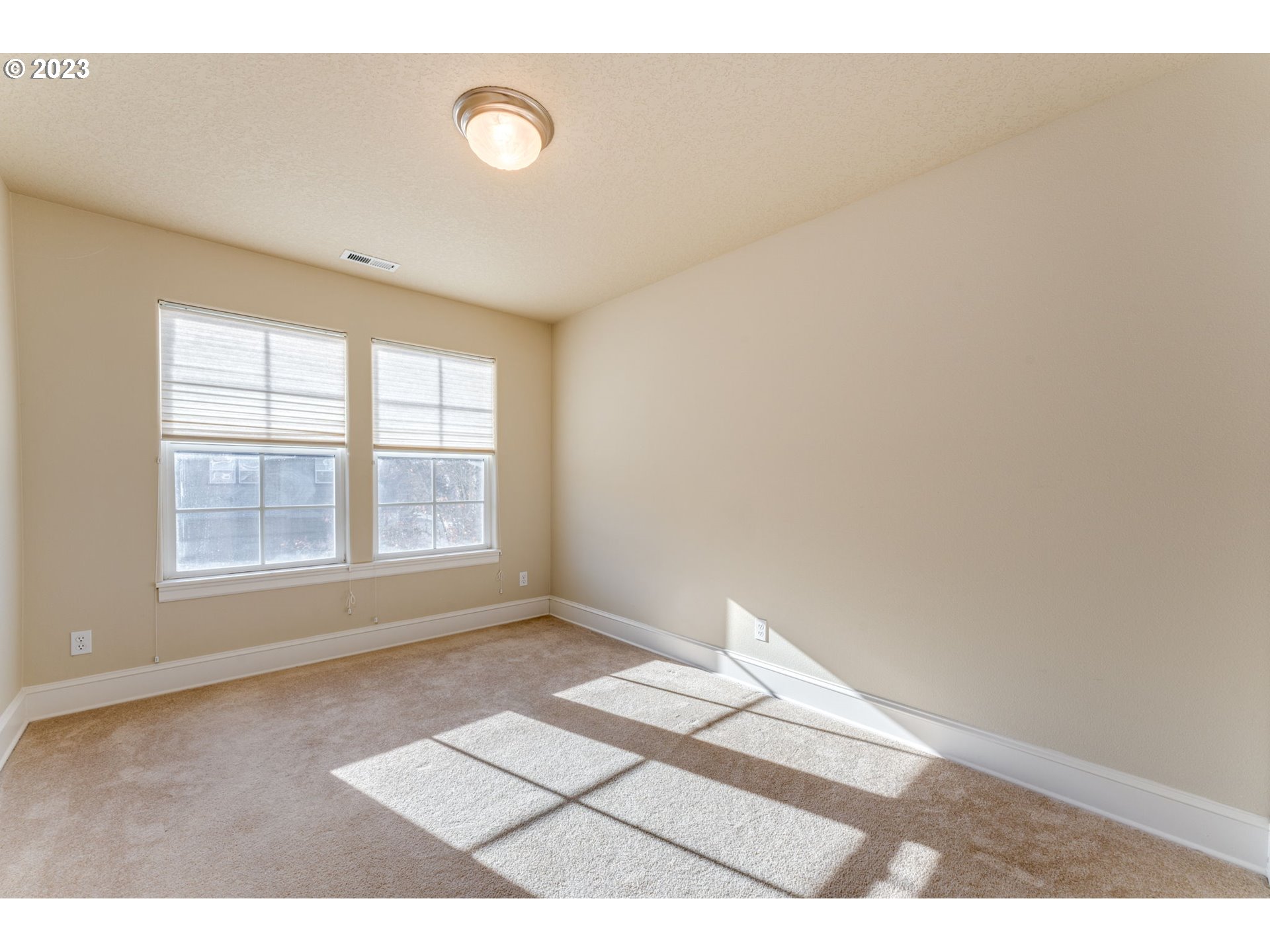 12581 Northwest Forest Spring Lane Portland, OR 97229 - Photo 29 of 48 a view of an empty room with a window