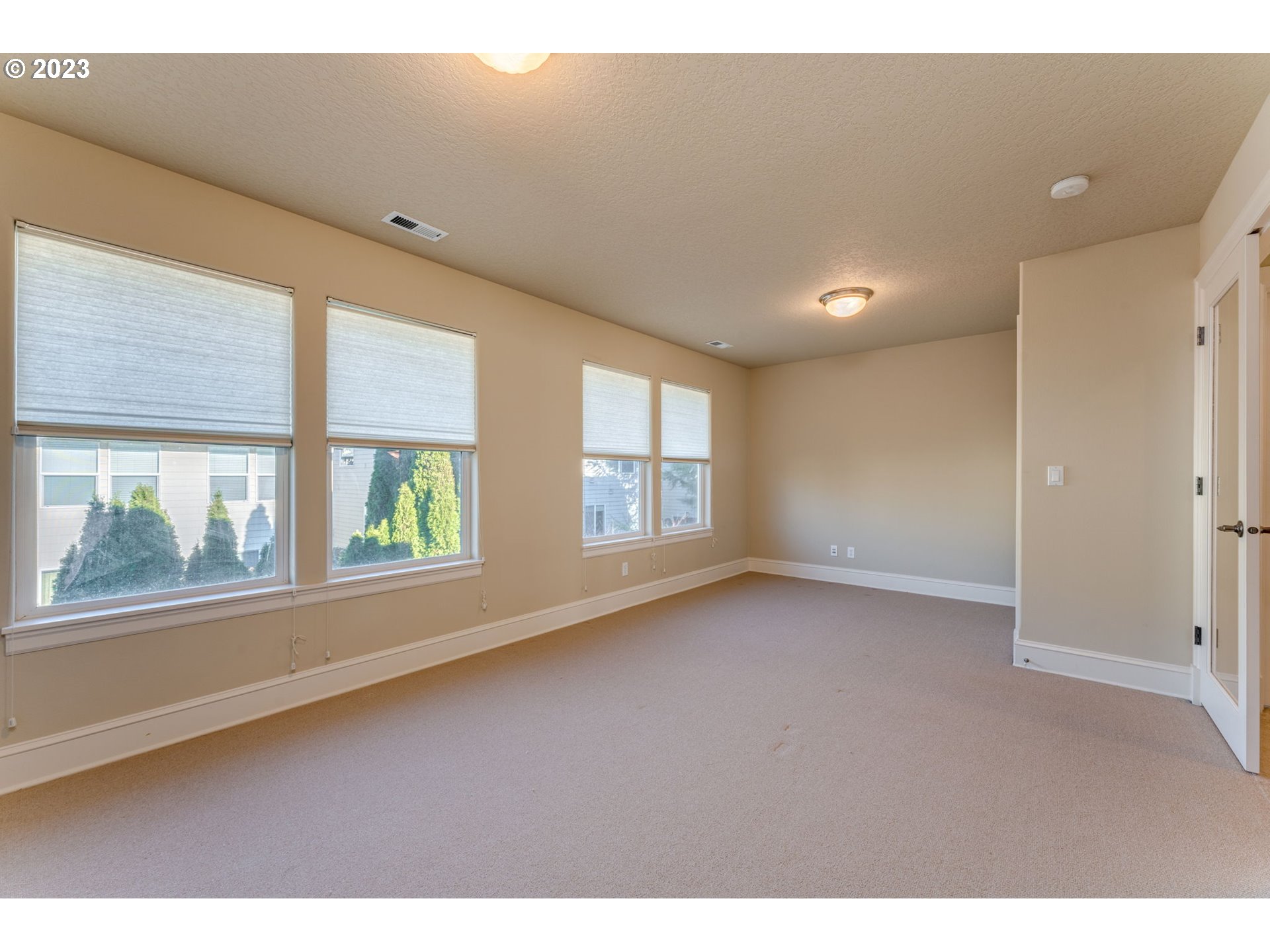 12581 Northwest Forest Spring Lane Portland, OR 97229 - Photo 31 of 48 a view of an empty room with a window