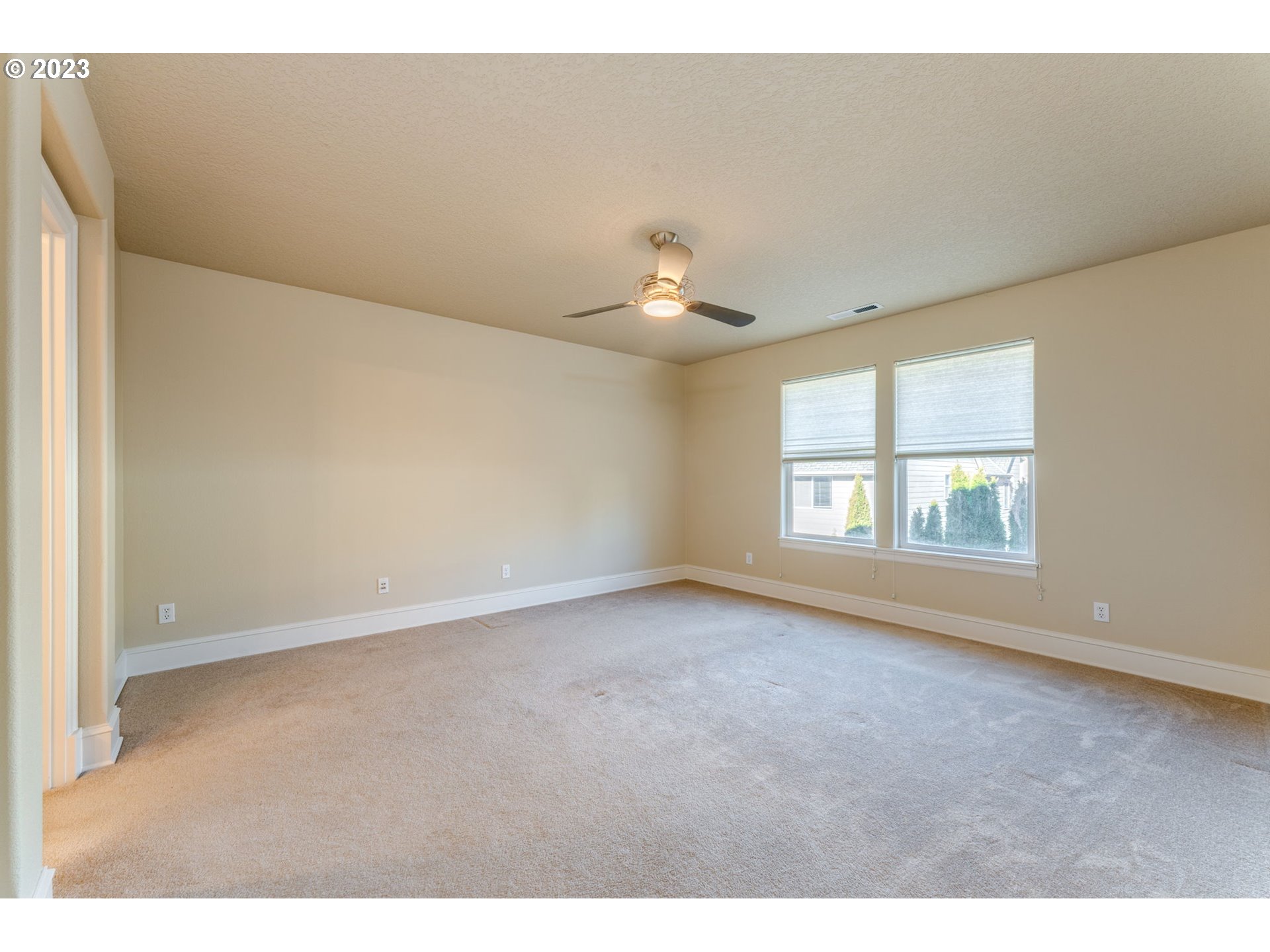 12581 Northwest Forest Spring Lane Portland, OR 97229 - Photo 34 of 48 a view of an empty room with a window