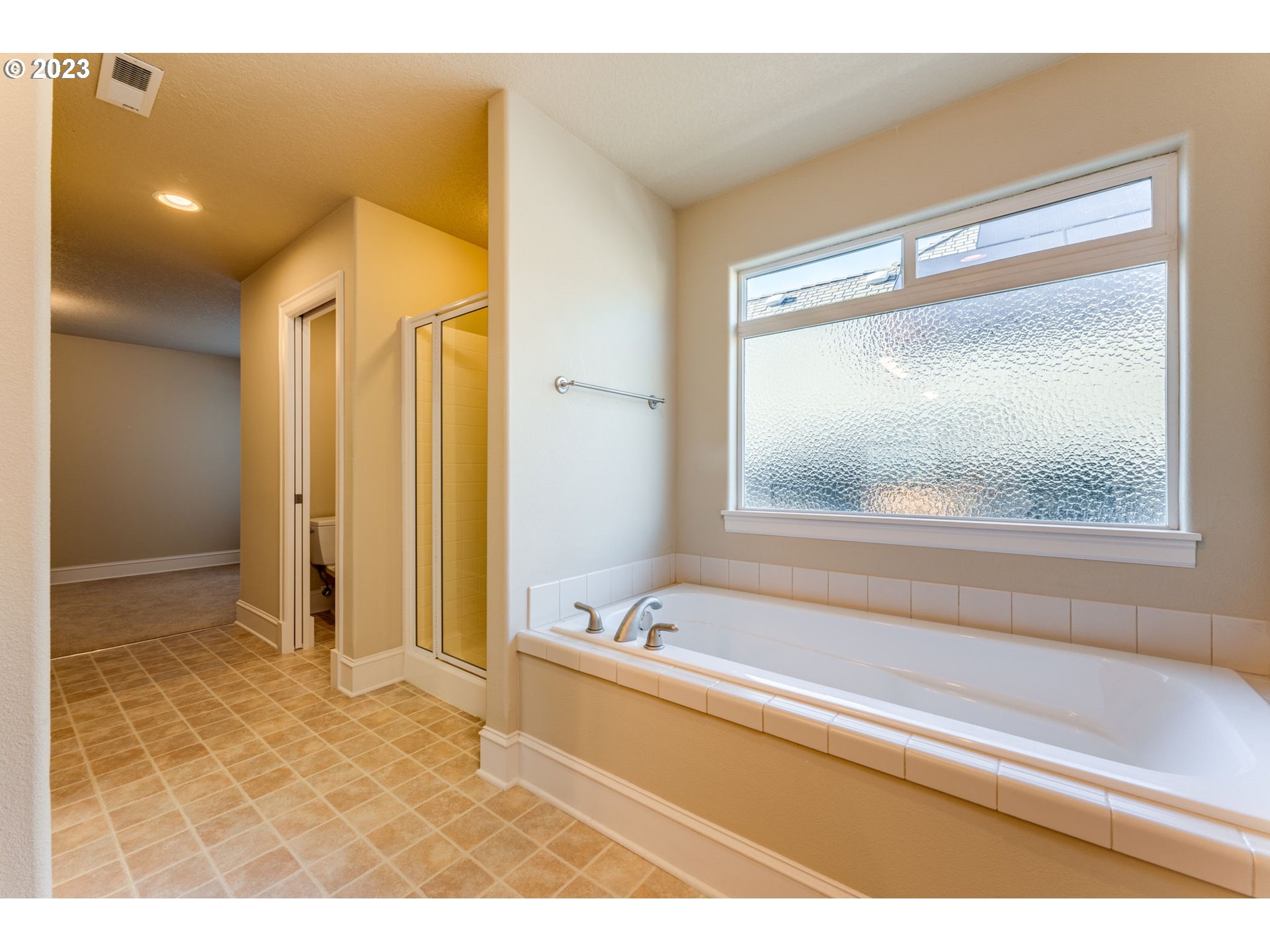 12581 Northwest Forest Spring Lane Portland, OR 97229 - Photo 37 of 48 a bathroom with a tub and a view of bathroom