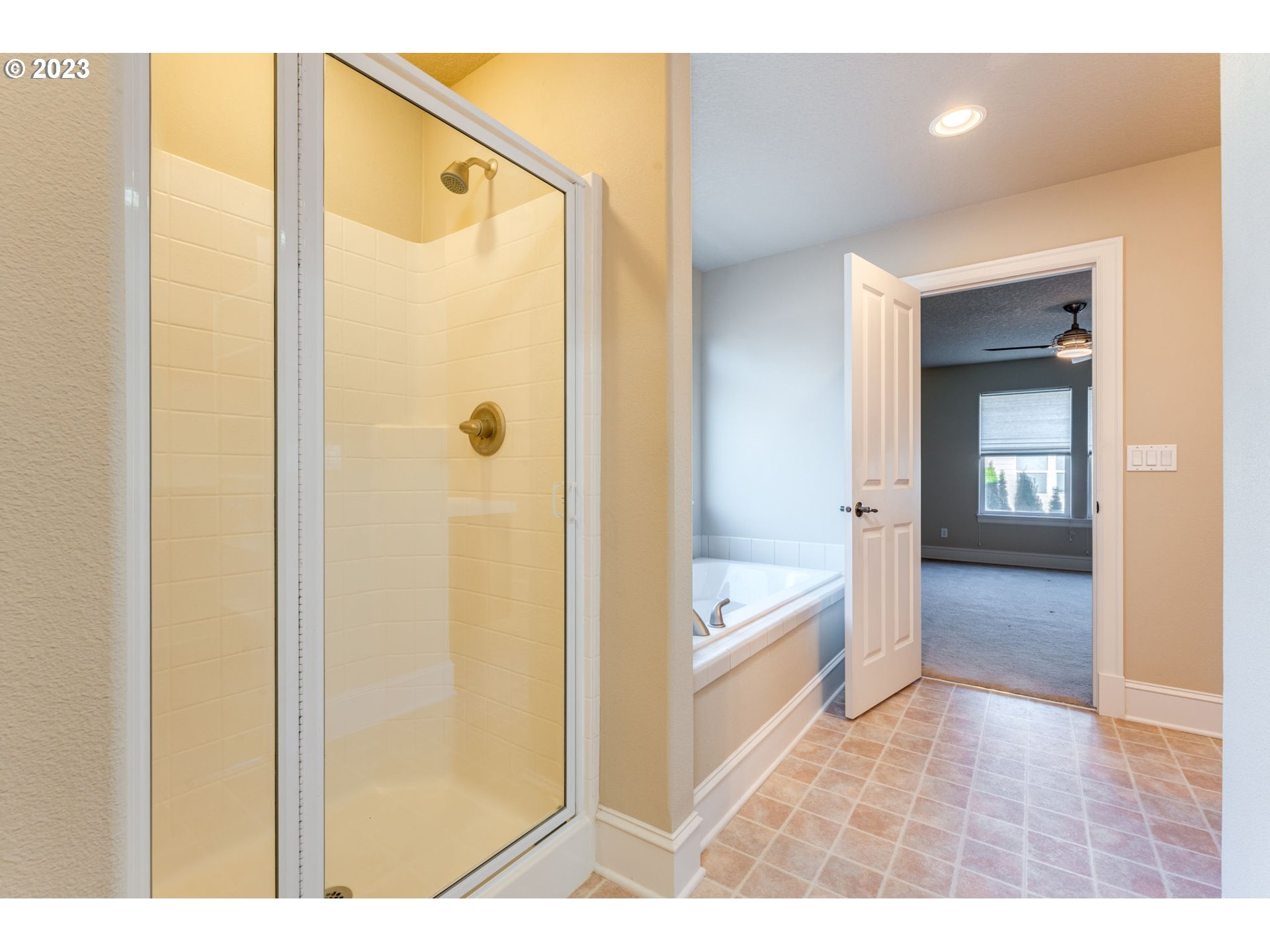 12581 Northwest Forest Spring Lane Portland, OR 97229 - Photo 38 of 48 a bathroom with a glass shower door