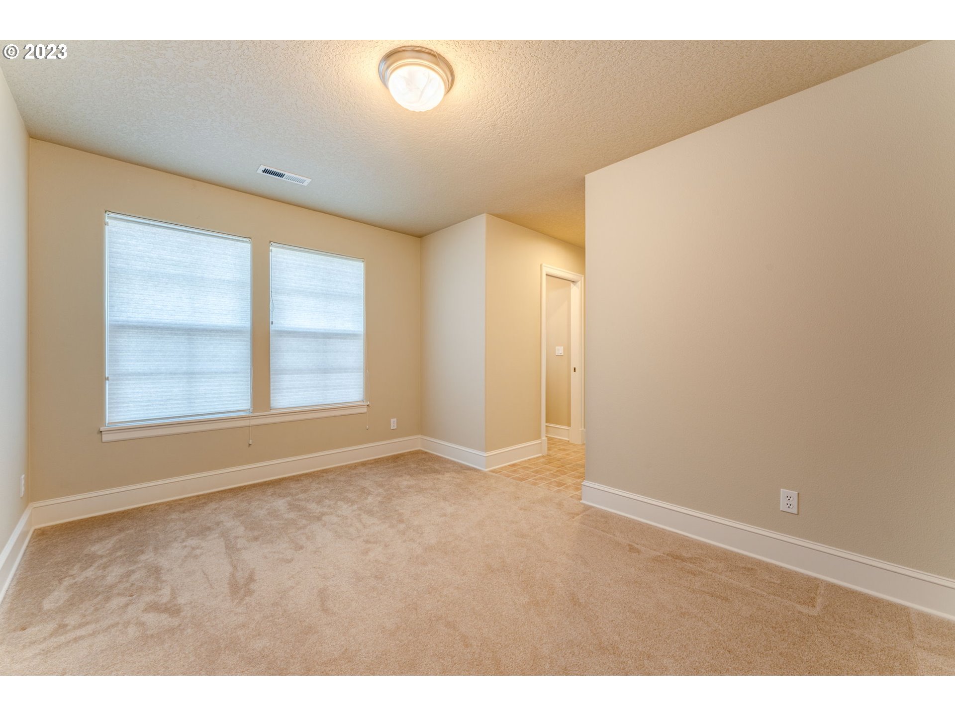 12581 Northwest Forest Spring Lane Portland, OR 97229 - Photo 40 of 48 a view of an empty room with a window