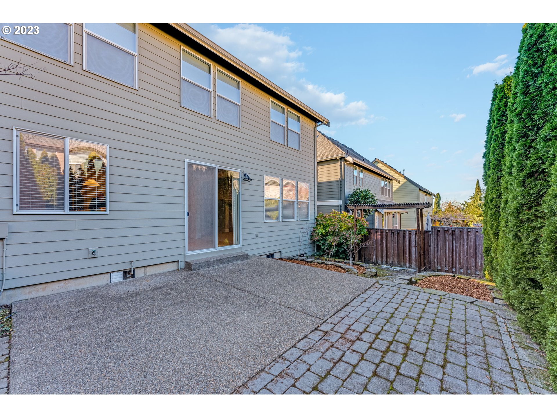 12581 Northwest Forest Spring Lane Portland, OR 97229 - Photo 43 of 48 a view of backyard with potted plants and a wooden bench