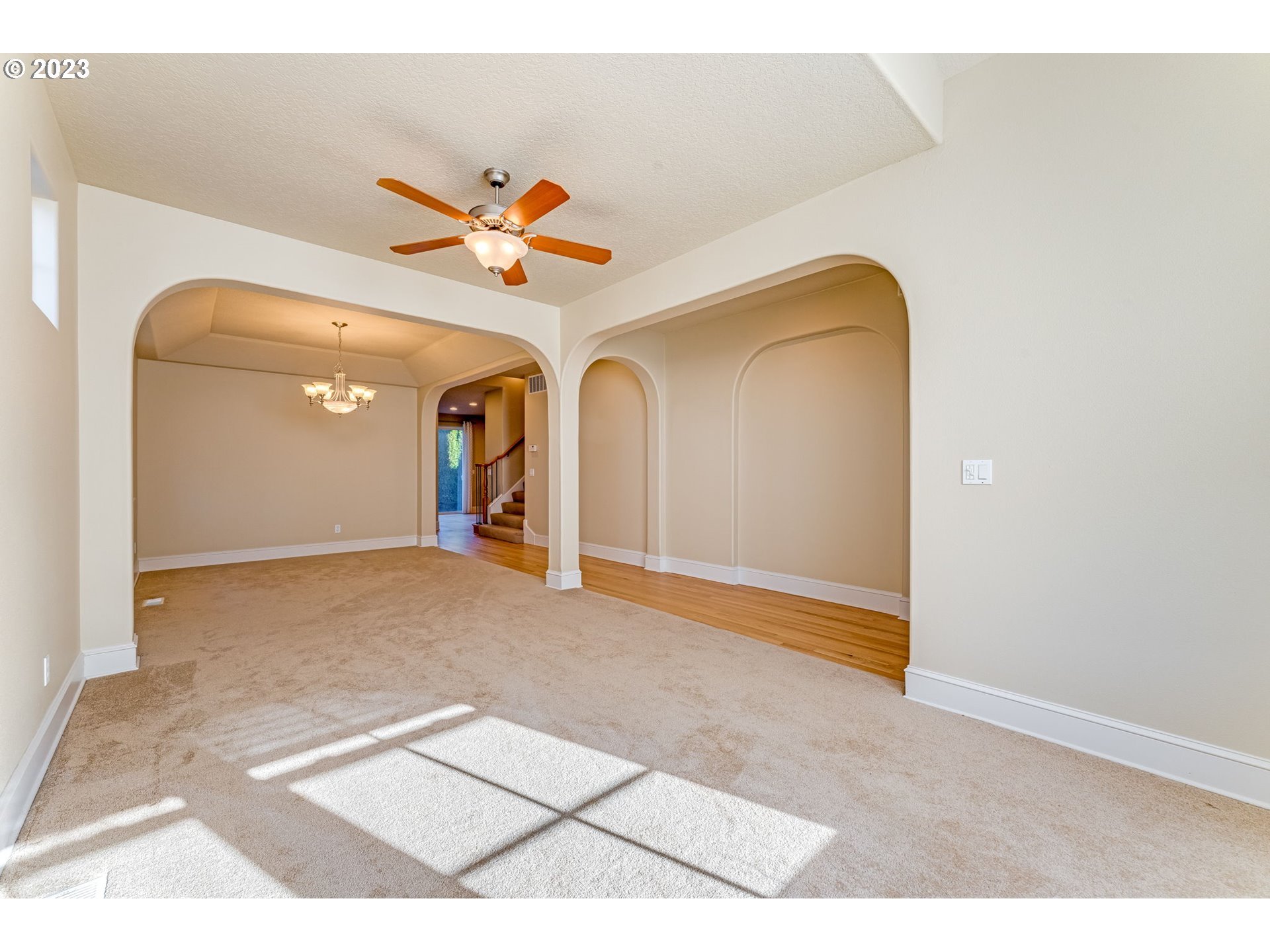 12581 Northwest Forest Spring Lane Portland, OR 97229 - Photo 7 of 48 a view of a livingroom with a staircase