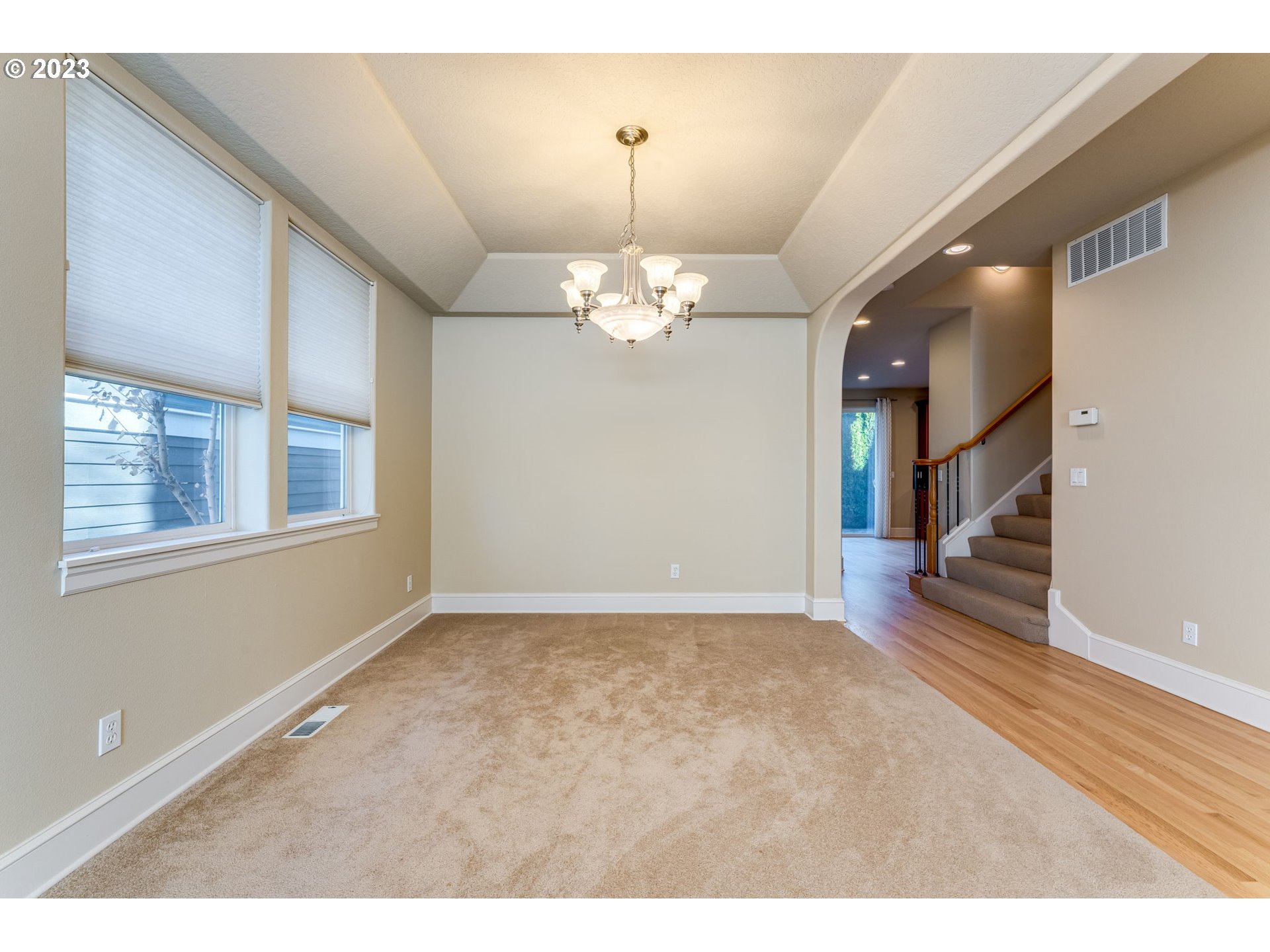 12581 Northwest Forest Spring Lane Portland, OR 97229 - Photo 8 of 48 a view of an empty room with wooden floor and a window