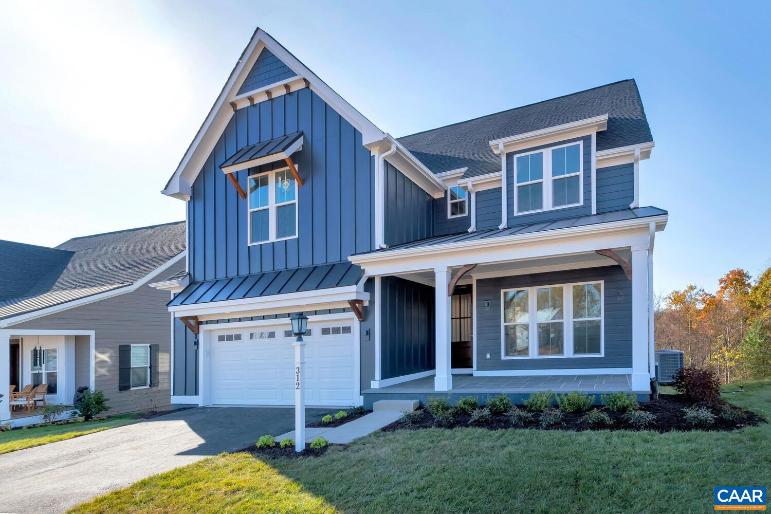 115226 Riparian Court Charlottesville, VA 22911 - Photo 1 of 49 a front view of a house with garden