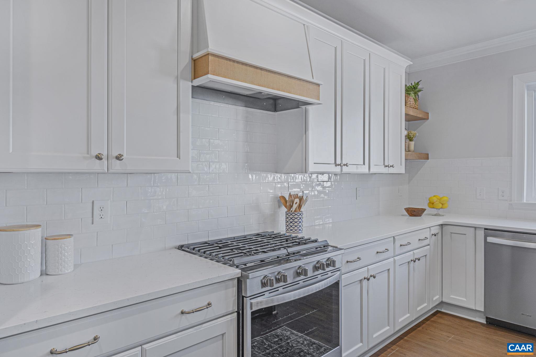 115226 Riparian Court Charlottesville, VA 22911 - Photo 20 of 49 a kitchen with white cabinets and white appliances
