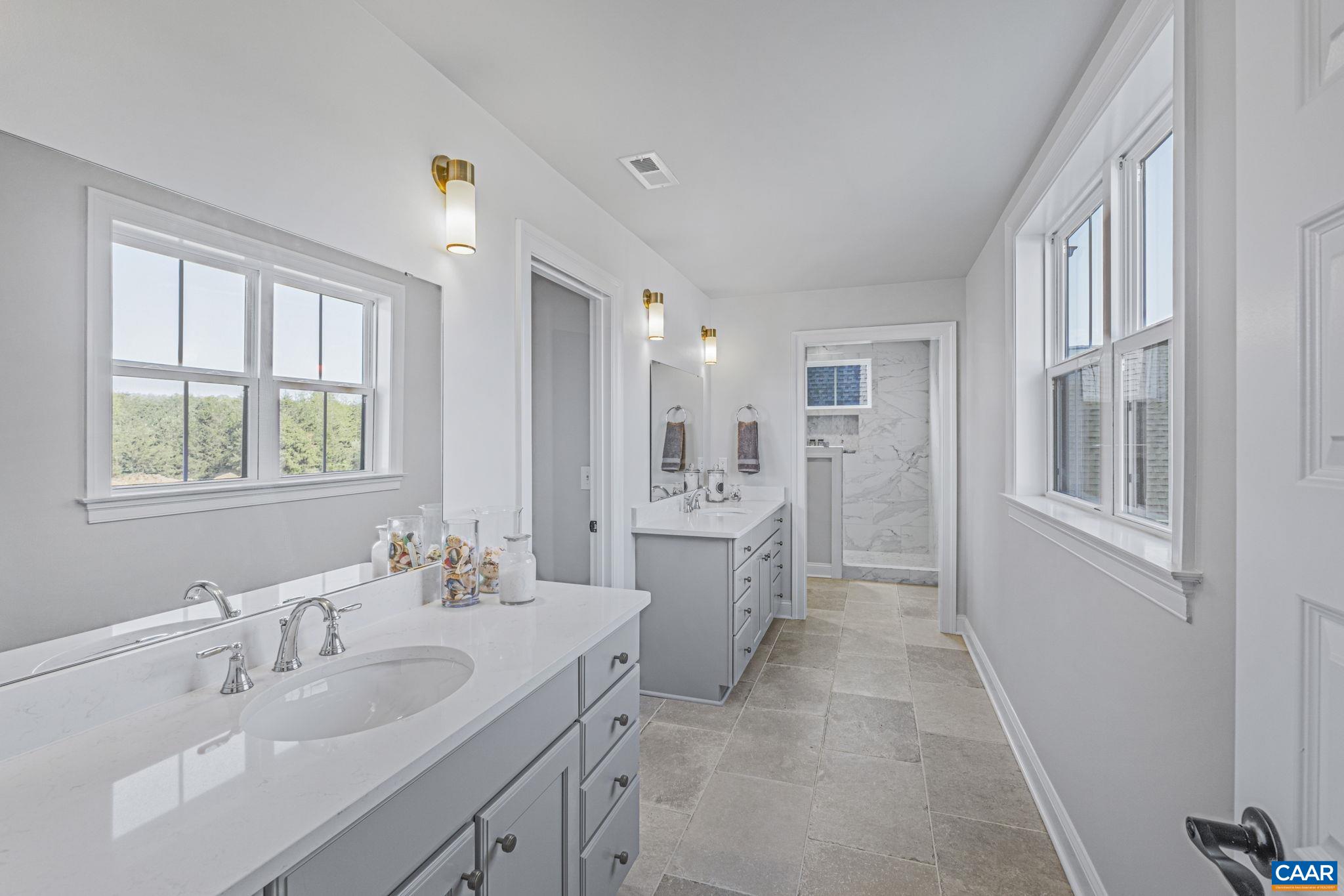 115226 Riparian Court Charlottesville, VA 22911 - Photo 25 of 49 a bathroom with a double vanity sink mirror and double