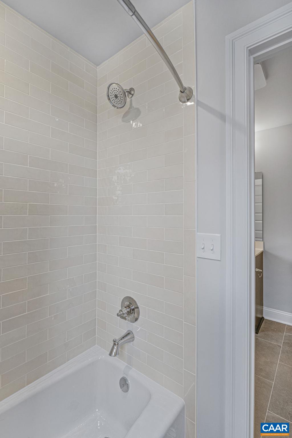 115226 Riparian Court Charlottesville, VA 22911 - Photo 39 of 49 a bathroom with a bathtub and a shower